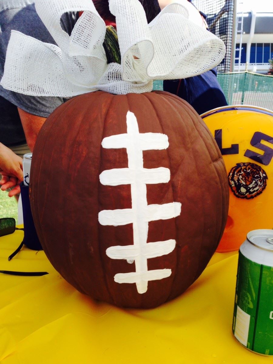 Painted pumpkin football centerpieces LSU tailgate