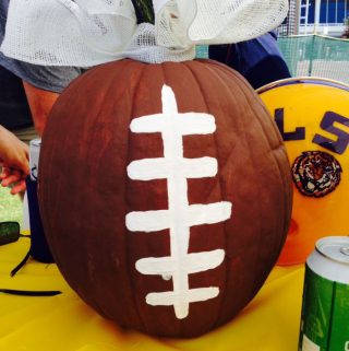 Painted pumpkin football centerpieces LSU tailgate
